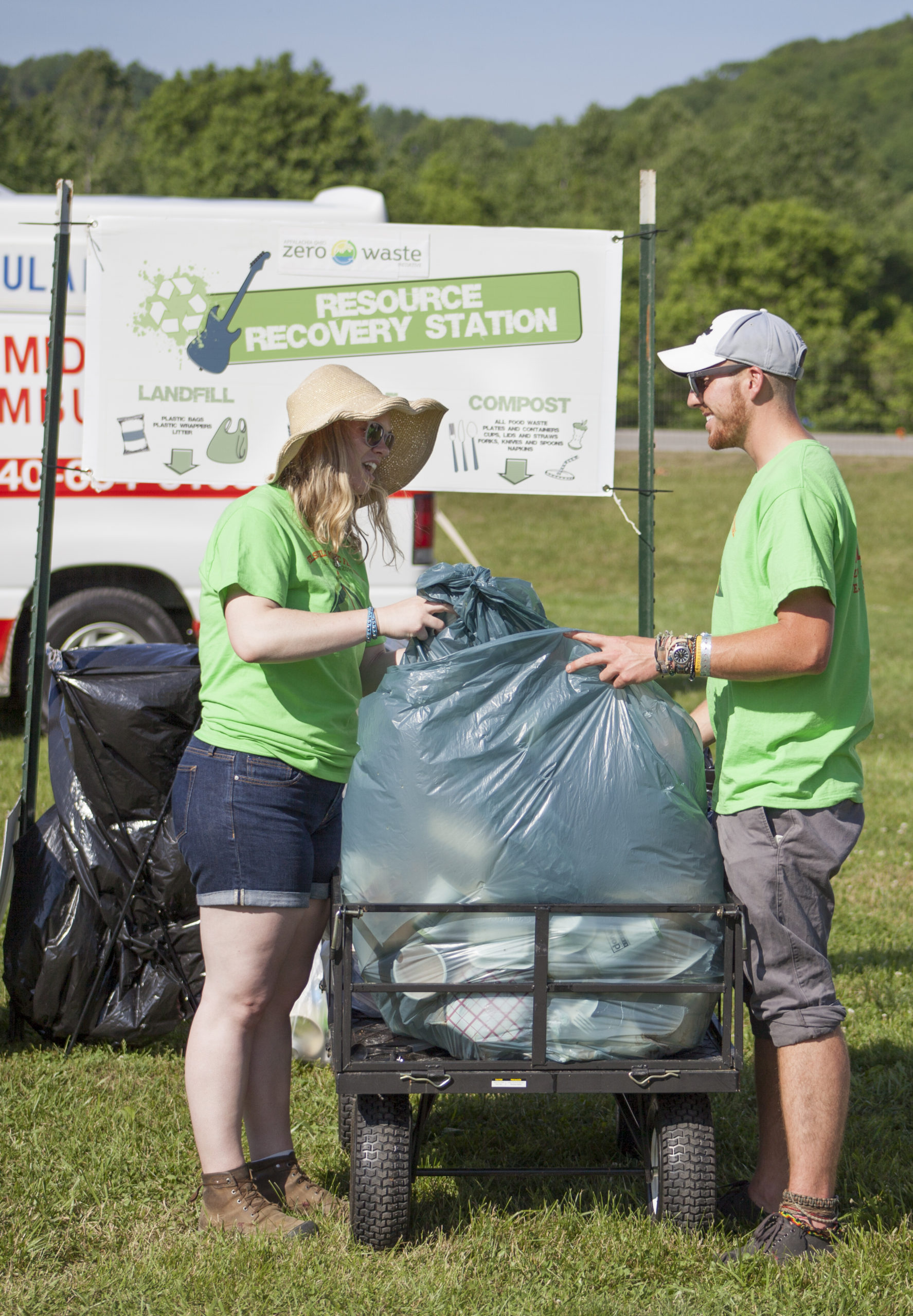 Zero Waste Volunteers collect full bags of compost from the grounds at Nelsonville Music Festival. 